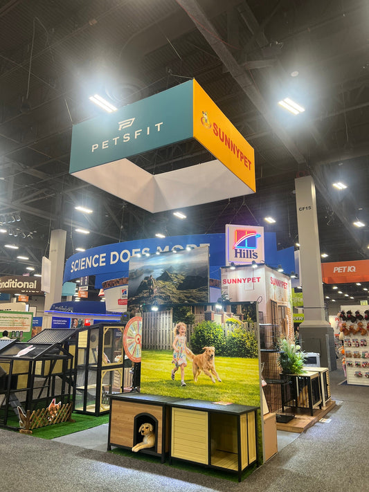 Sunnypet booth at SuperZoo 2026 in Las Vegas, featuring wooden dog houses, chicken coops and outdoor pet furniture