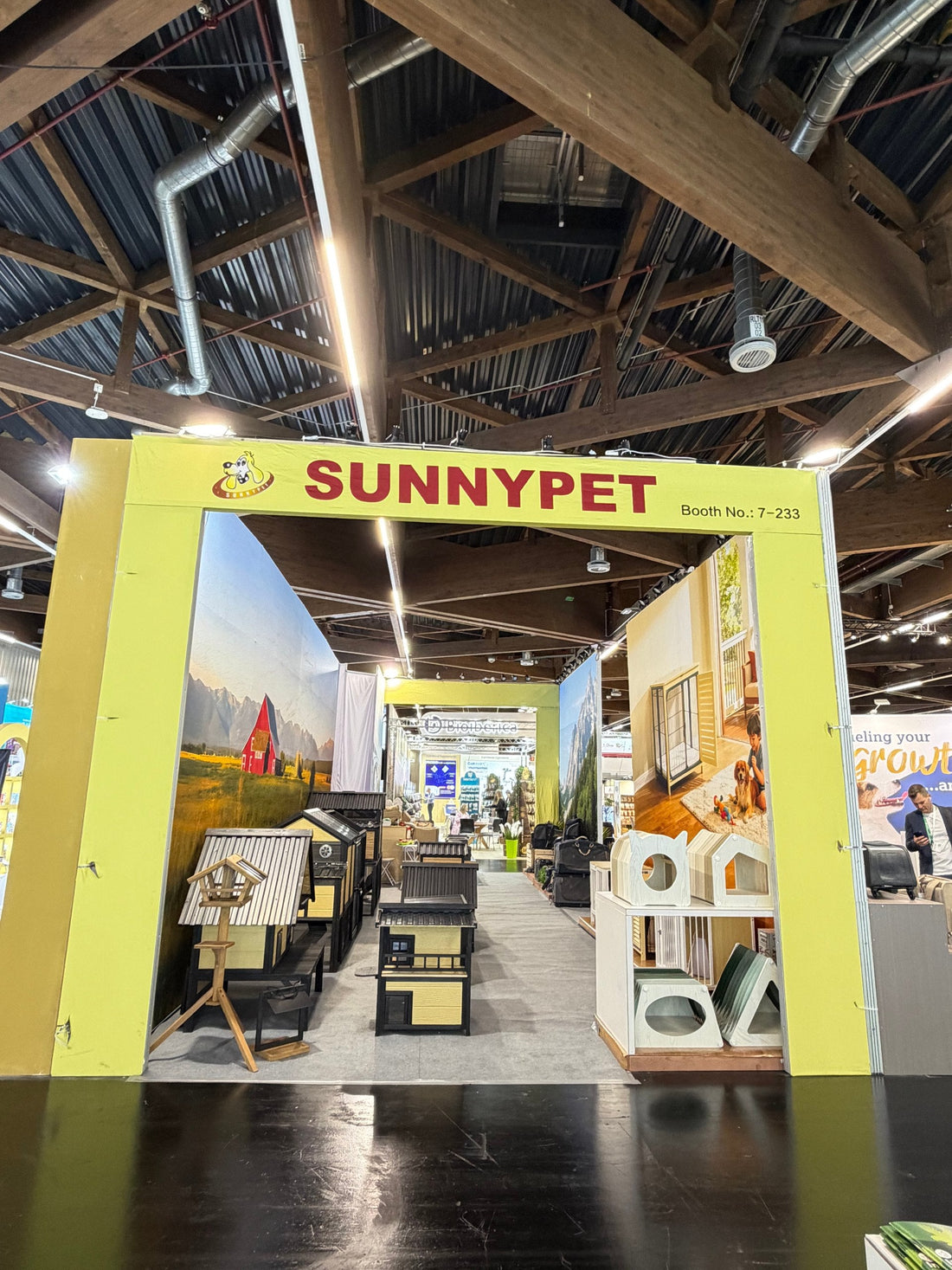 SUNNYPET Booth 7-233 at Interzoo 2026 Nuremberg — real booth entrance with pet housing products on display